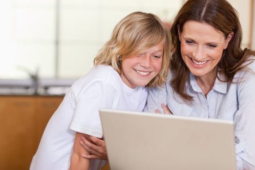 Woman and her son with laptop