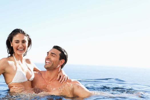 Couple enjoying their time together in the pool