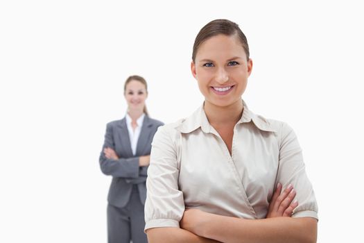 Smiling businesswomen posing against a white background