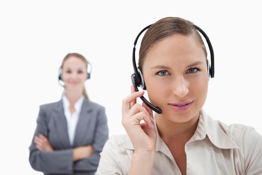 Beautiful operators with headsets against a white background