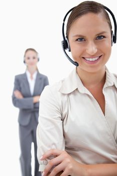 Portrait of operators with headsets against a white background