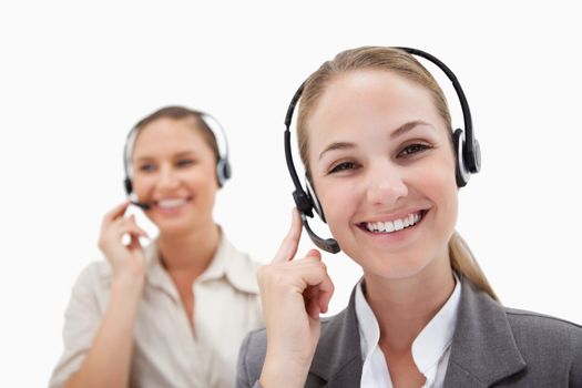 Happy operators using headsets against a white background