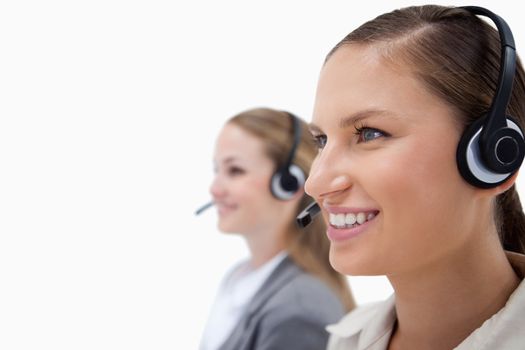 Female operators using headsets against a white background