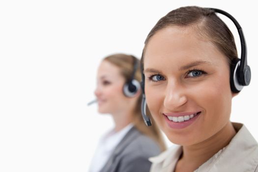 Sales persons using headsets against a white background