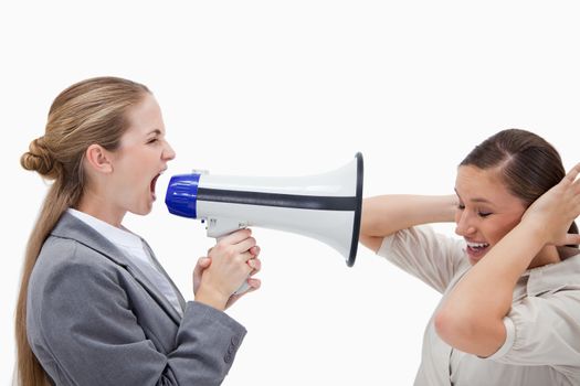 Manager yelling at her coworker through a megaphone against a white background