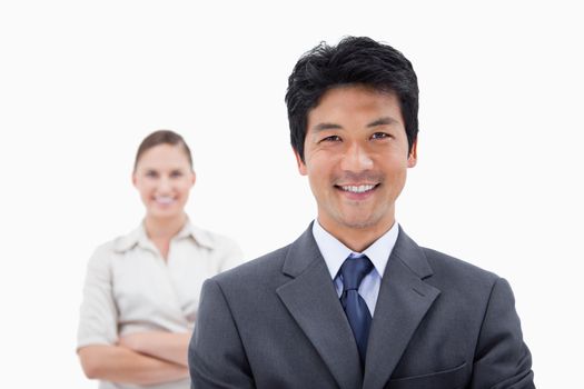 Smiling business people posing against a white background