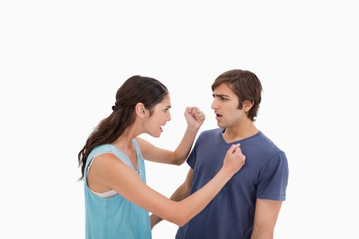 Couple having an argument against a white background