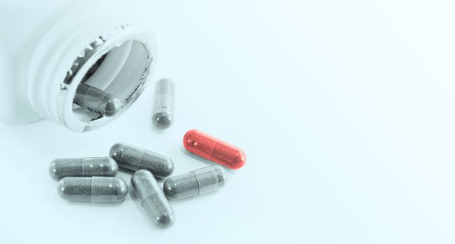 Capsules herbal drugs poured from a bottle