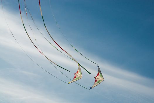 Two kites flying in the sky