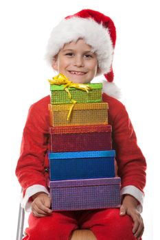 Boy holding a christmas gift isolated on white background