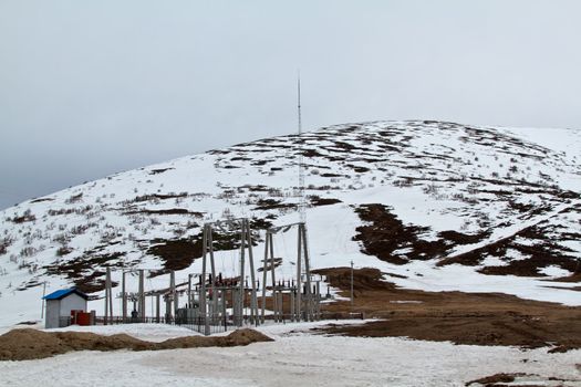 Power plant station in mountain with snow