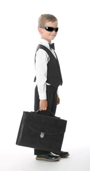 Boy holding a briefcase isolated on white background