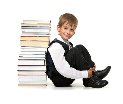 Boy and books isolated on a white background