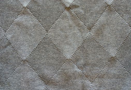 Knitted wool pattern rhomb form grey color background