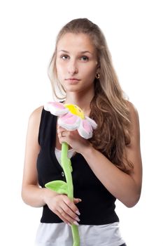 Portrait of a beautiful girl with long hair plush flower studio shooting