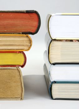 A pile of various new and old hardcover books