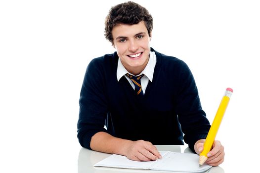Smiling attractive youngster kid studying isolated over white background