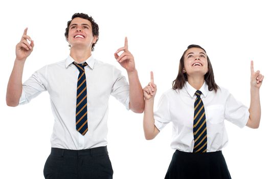 Schoolmates looking and pointing upwards. All on white background