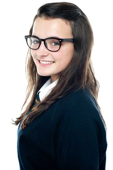Side view of an adorable teenager wearing spectacles. Close up shot