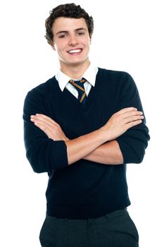 Profile shot of a school going teen in uniform posing with arms crossed