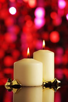 Candles Christmas on red background, copy space