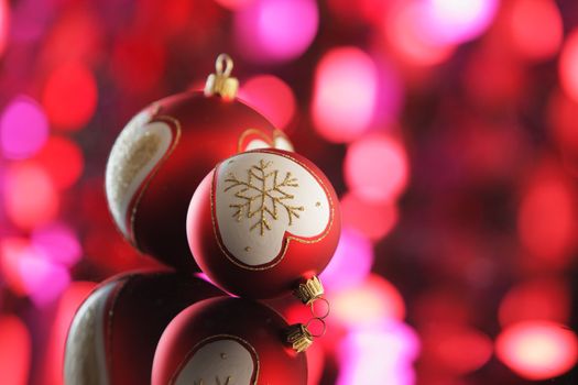 Two Christmas balls on colorful background