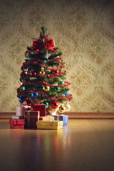 Christmas tree with gifts on decorative wallpaper