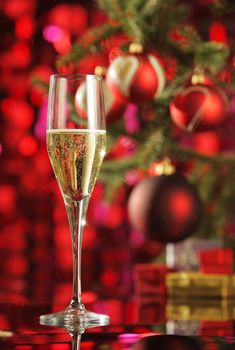 Glass of champagne with Christmas decorations