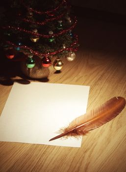 Christmas tree with gifts and greeting card, copy space