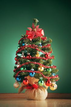 Christmas tree on green background