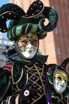 Funny gaze on the green joker mask. Venice carnival 2012 