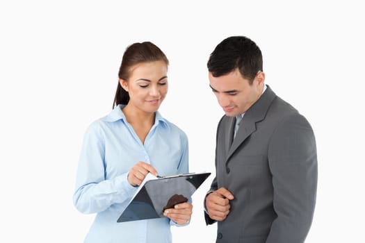 Businesswoman showing data to her partner against a white background