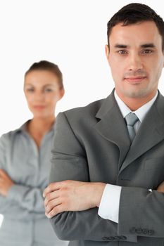 Close up of business partners with arms folded against a white abckground