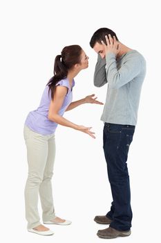 Young couple in a fight against a white background