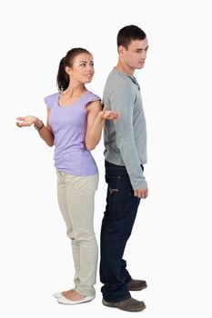 Young couple experiencing relationship problems against a white background