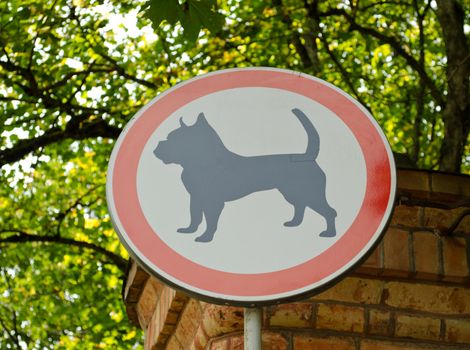 No dog sign on entrance to beautiful park territory.