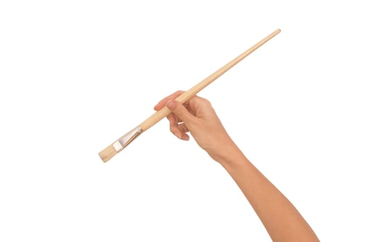 woman paints a picture with a white brush
