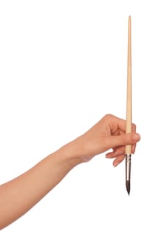 woman drawing a picture with a brush