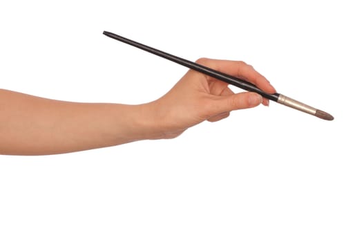 woman paints a picture with a brush