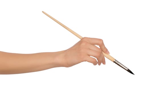 woman paints a picture with a brush