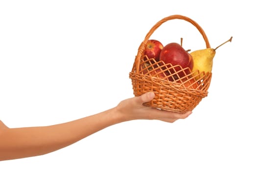Basket with yellow pears and red apples in the hand