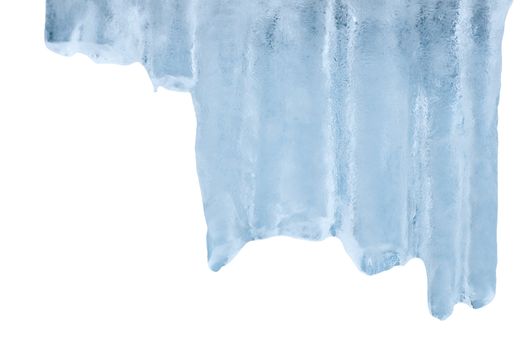 Thawing icicles of a blue shade with water droplets