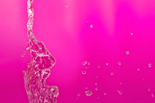 pouring fresh tropical sea water in a glass aquarium