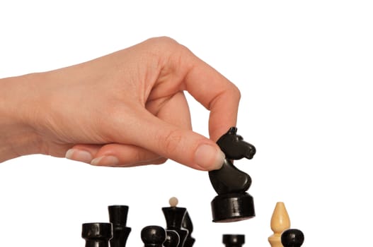 Woman playing chess and making black knights move
