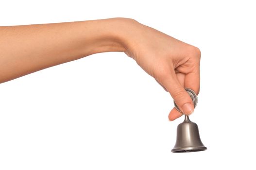 hand bell in the woman's hand for ringing