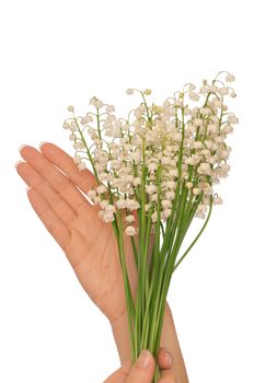 Woman holding lily of the valley in the hand