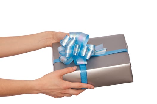 woman giving a silver box with blue bow as a gift