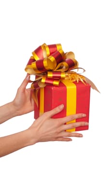woman giving a red box with yellow bow as a gift