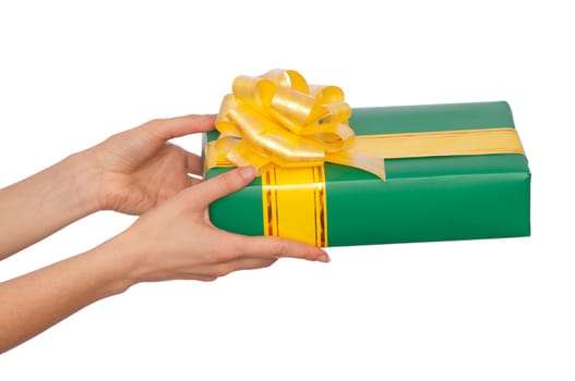 woman giving a green box with yellow bow as a gift