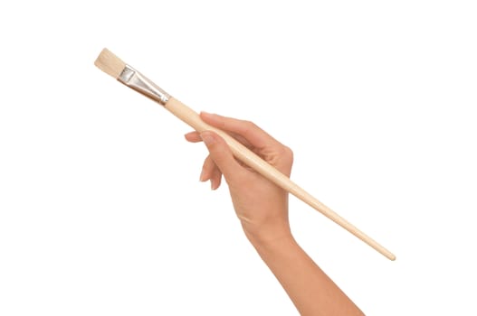 woman paints a picture with a brush